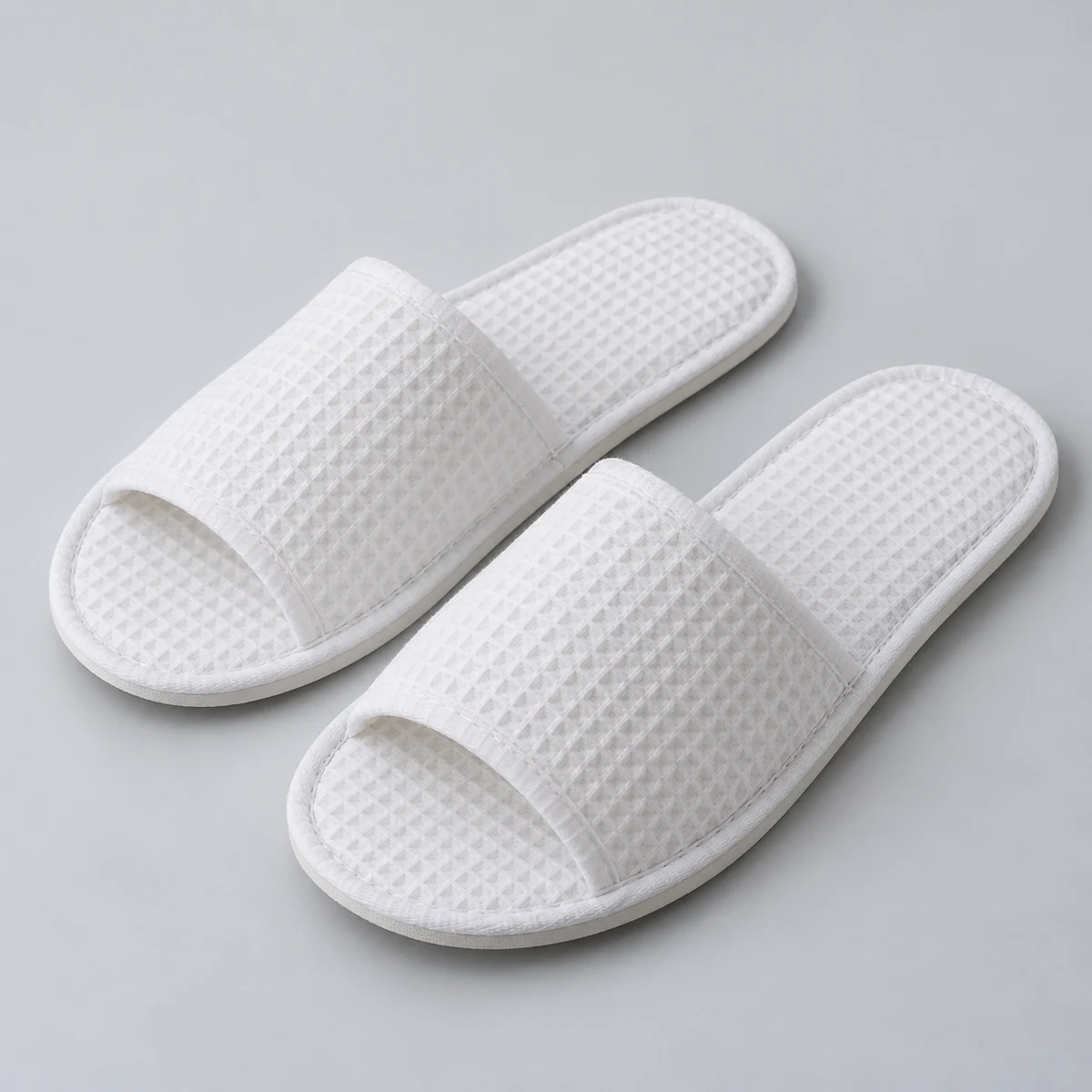 Waffle disposable slipper fabric and construction